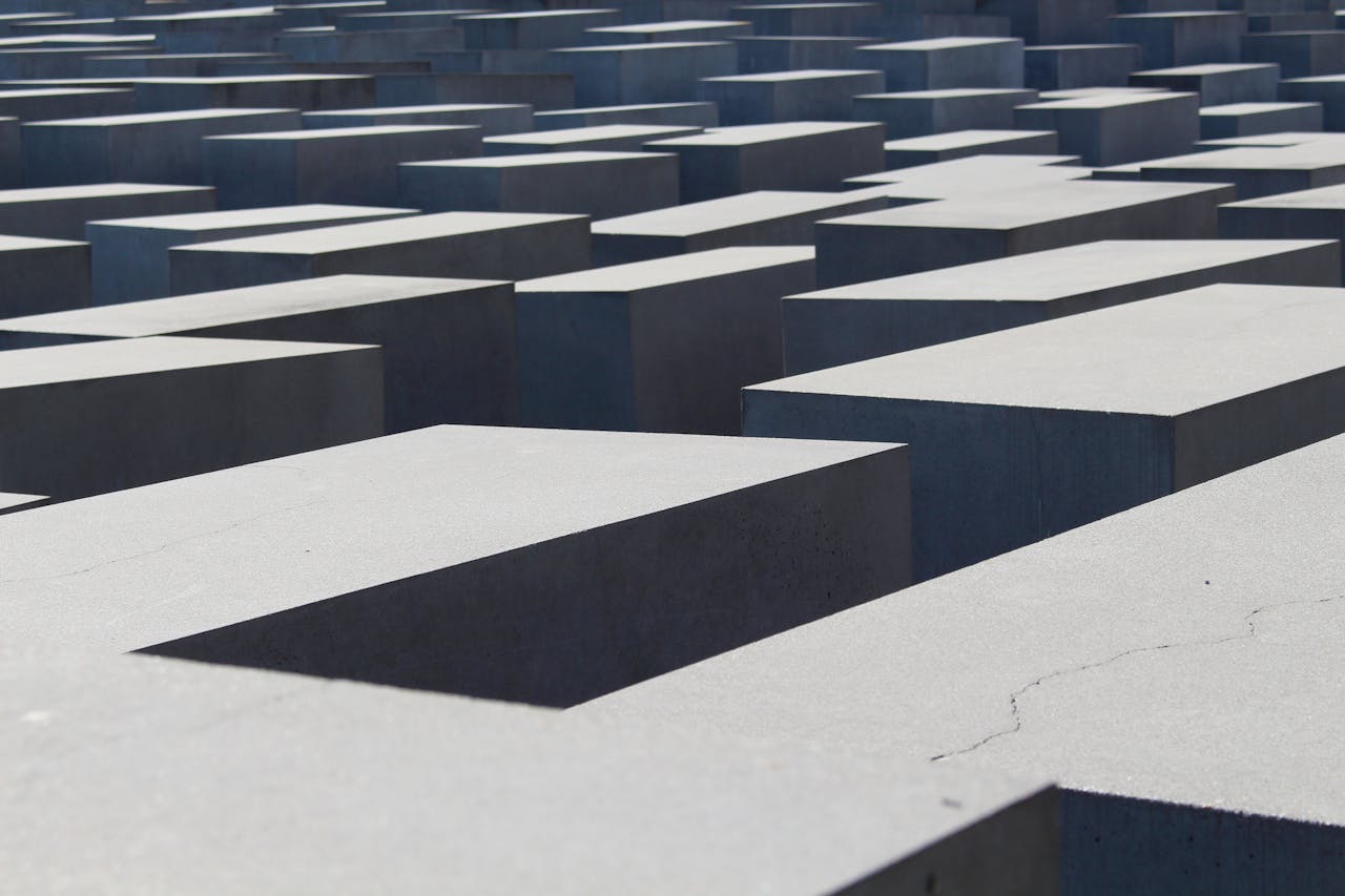 Abstract view of Berlin's Holocaust Memorial concrete blocks, evoking history and reflection.