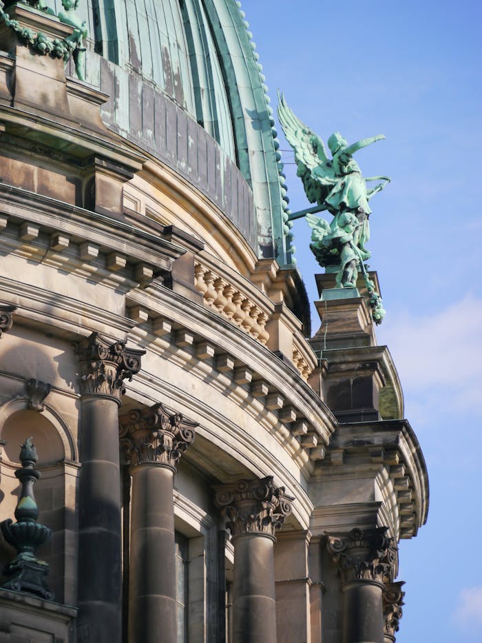A stunning low angle view of the Berlin Cathedral's intricate architecture and sculptures.